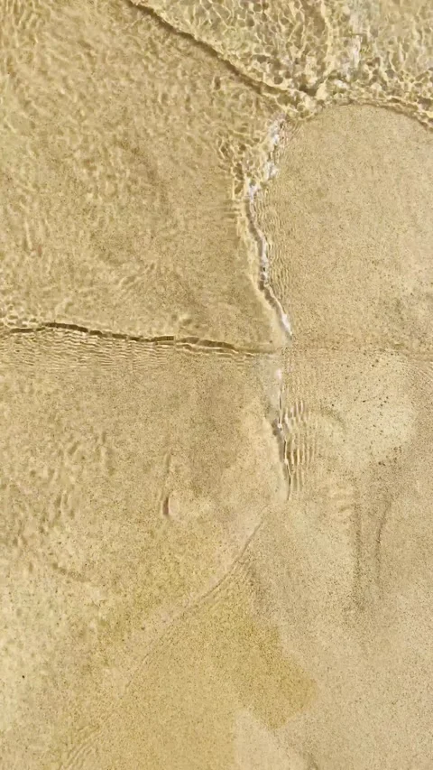 Sand under water waves Stock Footage 139772636