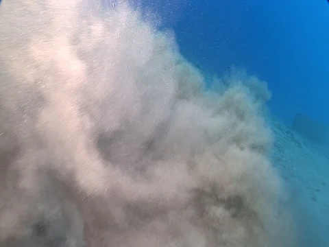 Sand underwater moving making shapes and rolling Stock Footage 105401358