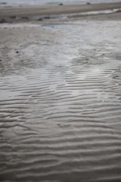 A sand waves on the beach Stock Photos