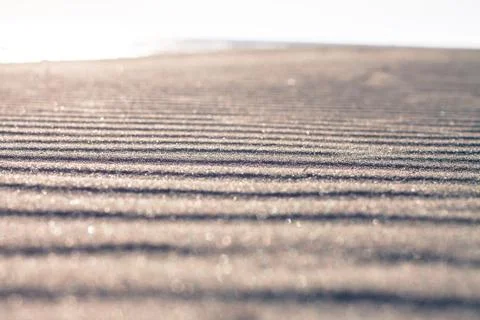 Sand waves on the beach Fotos Stock