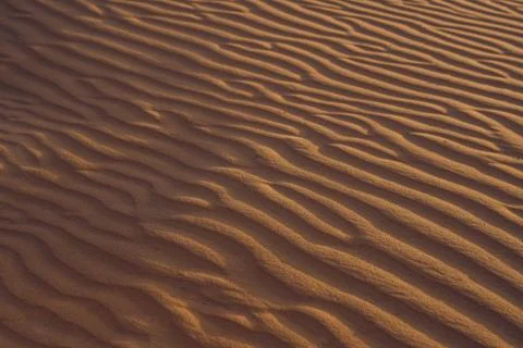 Sand with waves in the red desert Foto stock
