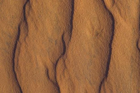 Sand with waves in the red desert Foto stock