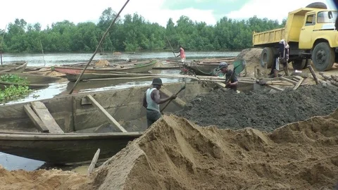 Sand workers on their pirogues Stock Footage 81425879
