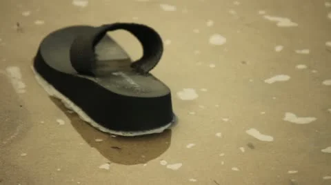 Sandal Floating In Water Stock Footage 11443032