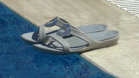 Sandals And Swimming Pool Stock Footage 95784469