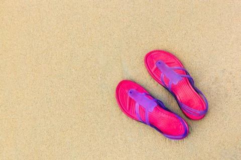 Sandals on the beach - concept image Stock Photos