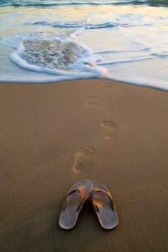 Sandals on the beach Stock Photos