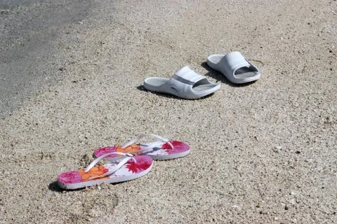 Sandals on the beach Stock Photos