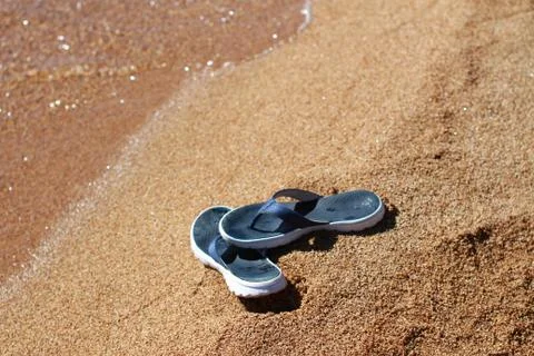 Sandals on beach Stock Photos