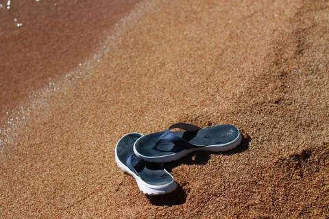 Sandals on beach Stock Photos