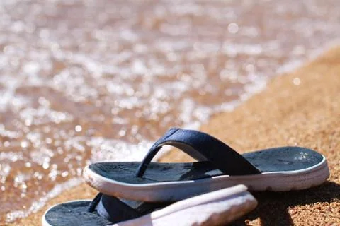 Sandals on the beach Stock Photos