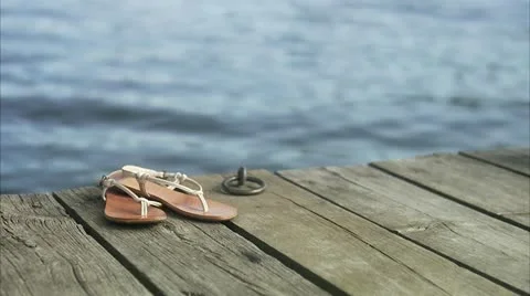 Sandals on a jetty Stock Footage 11287925