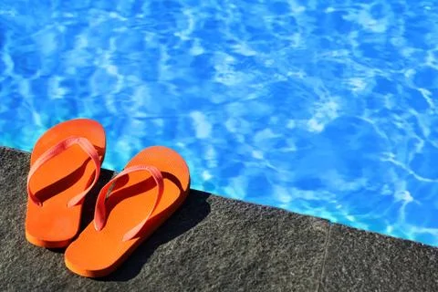 .sandals by a pool Stock Photos