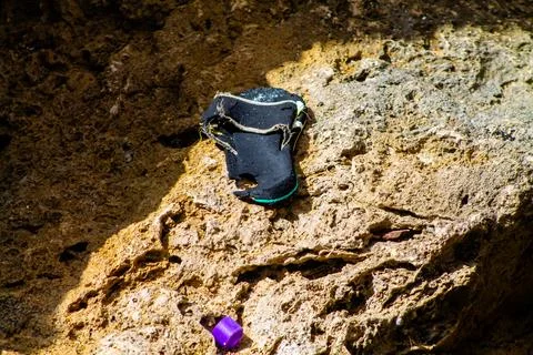 Sandals on the rocks. Close-up. Selective focus. Stock Photos
