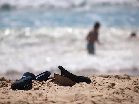 Sandals on the sand at the beach Foto stock