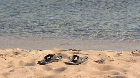 SANDALS ON THE SAND Stock Footage 27165833