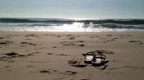 Sandals in sand Stock Footage 37388276