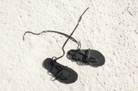Sandals on sand Stock Photos