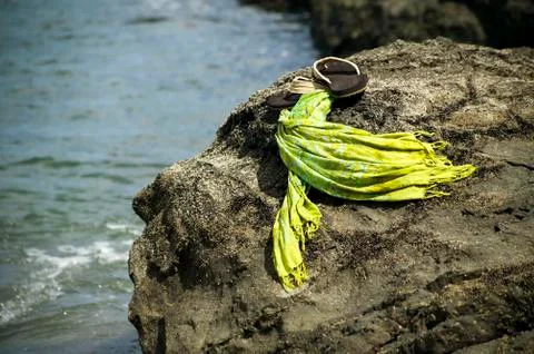 Sandals by the shore Stock Photos