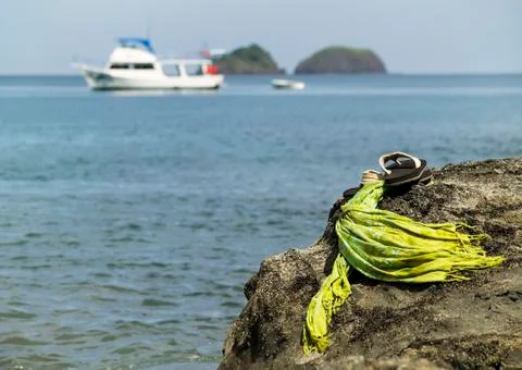 Sandals by the shore Stock Photos