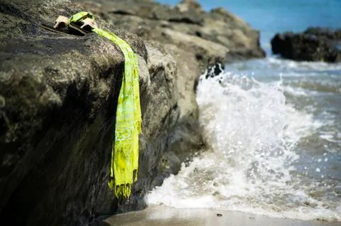 Sandals by the shore Stock Photos