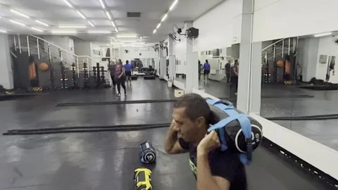 Sandbag back squat, functional training, body core, strength building Stock Footage 304316618