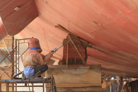 Sandblasting of metal structures at construction site Stock Photos