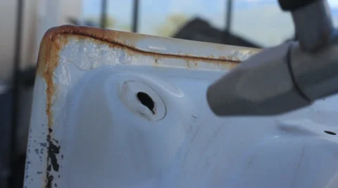 Sandblasting a old car trunk Stock Footage 27519967