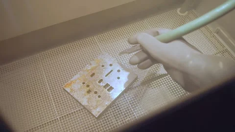 Sandblasting a rusty iron part in a special box. Stock Footage 265098699