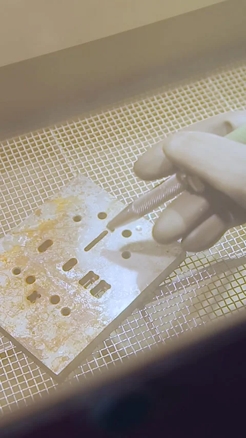 Sandblasting. Sandblasting a rusty iron part in a special box. Vertical video. Stock Footage 268016209