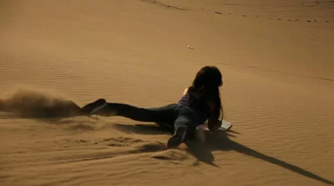 Sandboarding in Dunes Stock Footage 11419559