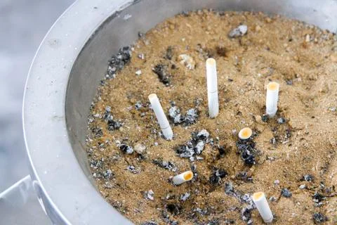 Sandbox ashtray in silver container Stock Photos