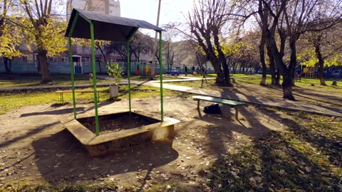 Sandbox on the playground sun into the camera Stock Footage 219241158