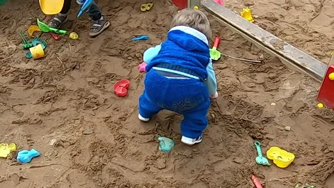 In the sandbox with toys Stock Footage 154514567