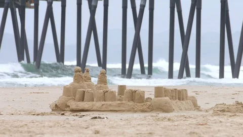 Sandcastle on Beach with Pier Stock-Footage 107572349