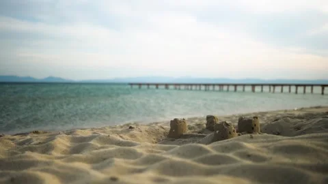Sandcastle On Beach With Pier Video Stock Footage 252641292