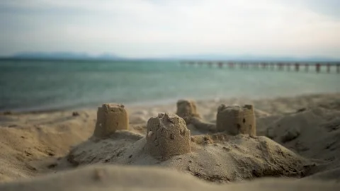 Sandcastle On Beach With Pier Video Stock Footage 252641984