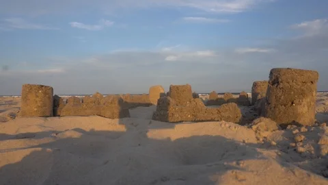 Sandcastle with waves in background Stock Footage 98909513