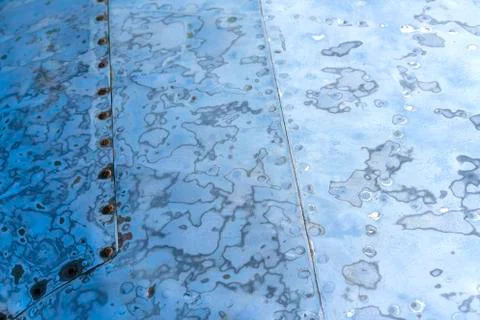 Sanded steel surface with rivets, blue color Stock Photos