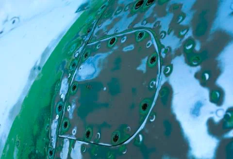 Sanded steel surface with rivets Stock Photos