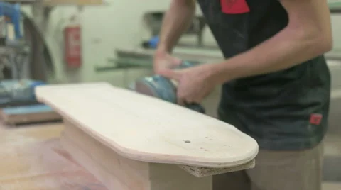 Sandering the longboard deck Stock Footage 58304406