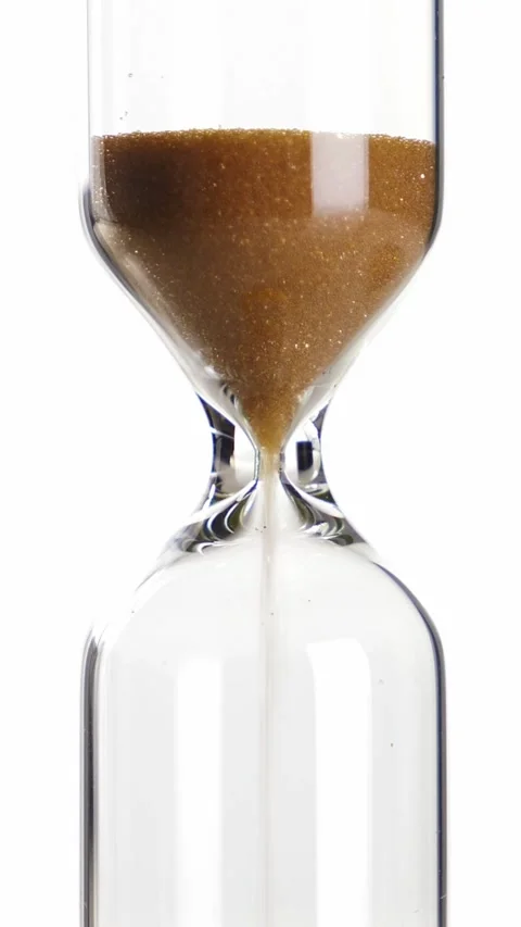 Sandglass isolated on white background. Time is running. Hourglass closeup Stock Footage 327094056