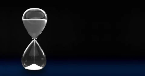 Sandglass timer on a dark background Stock Footage 148608099