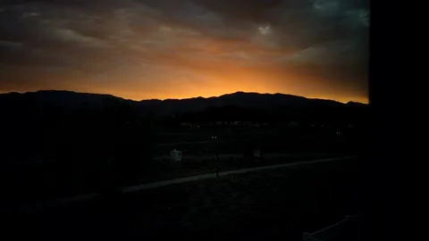 Sandia Mountains sunrise from room window Stock Footage