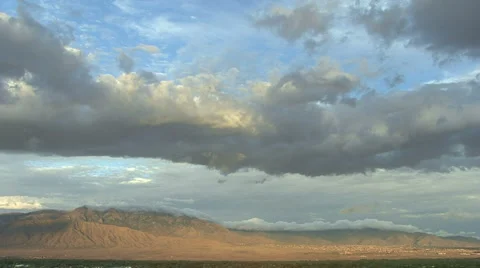 Sandia Mountain's with time-lapse clouds over the Rio Grande Valley, HD, TL Stock Footage
