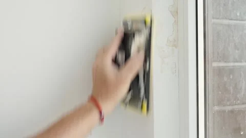 Sanding and cleaning old plaster, concept of repair Stock Footage 346725015
