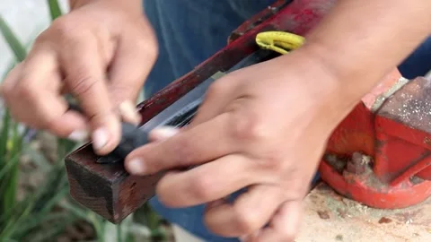 Sanding the knife with sand paper Stock Footage 150716604
