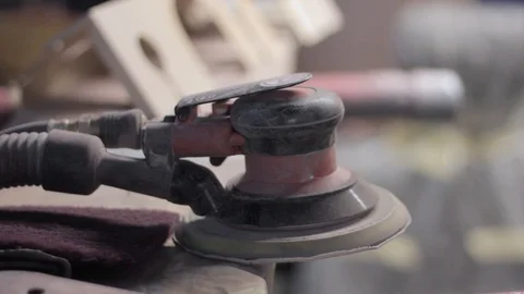 Sanding machine with working man at the background Stock Footage 129023044