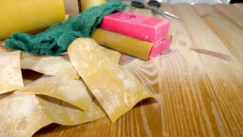 Sanding materials on a pine kitchen counter / worktop / drainer. Video stock 168607061