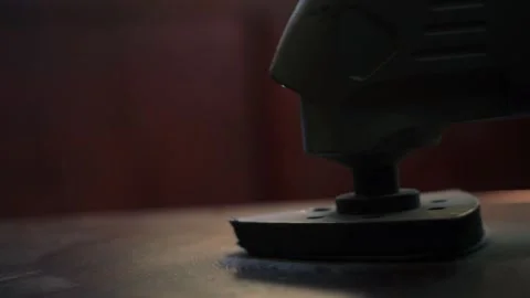 Sanding wooden surface with electrical sander tool Stock Footage 286240559